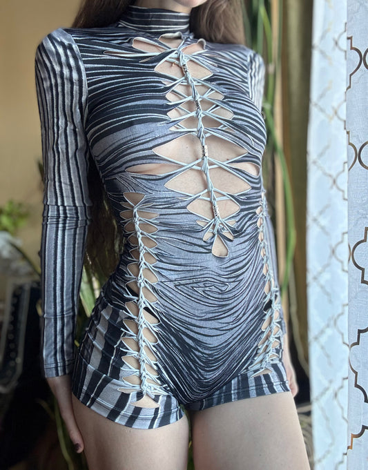 MONOCHROME ZEBRA MOCK NECK LONG SLEEVE BRAIDED ROMPER