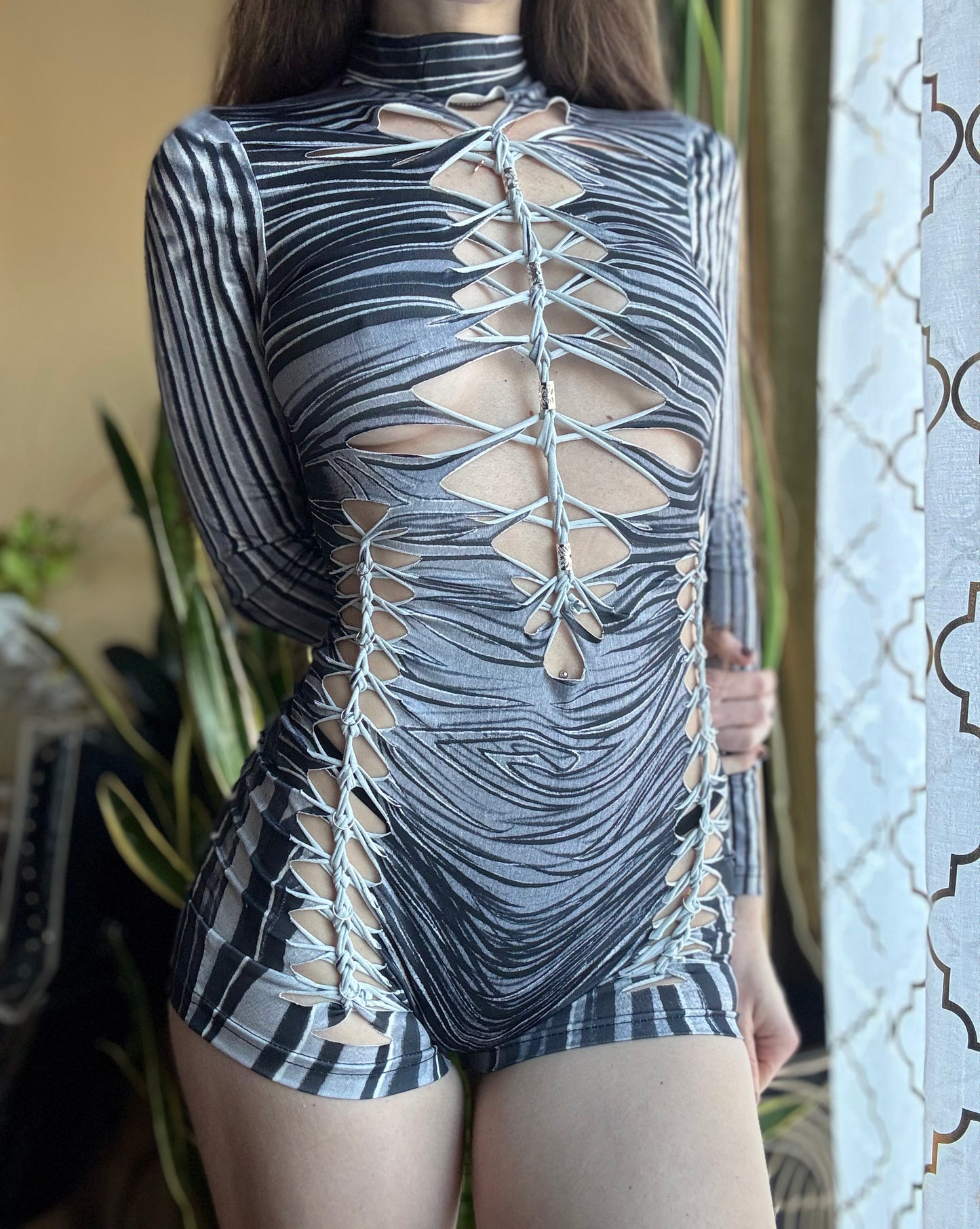 MONOCHROME ZEBRA MOCK NECK LONG SLEEVE BRAIDED ROMPER