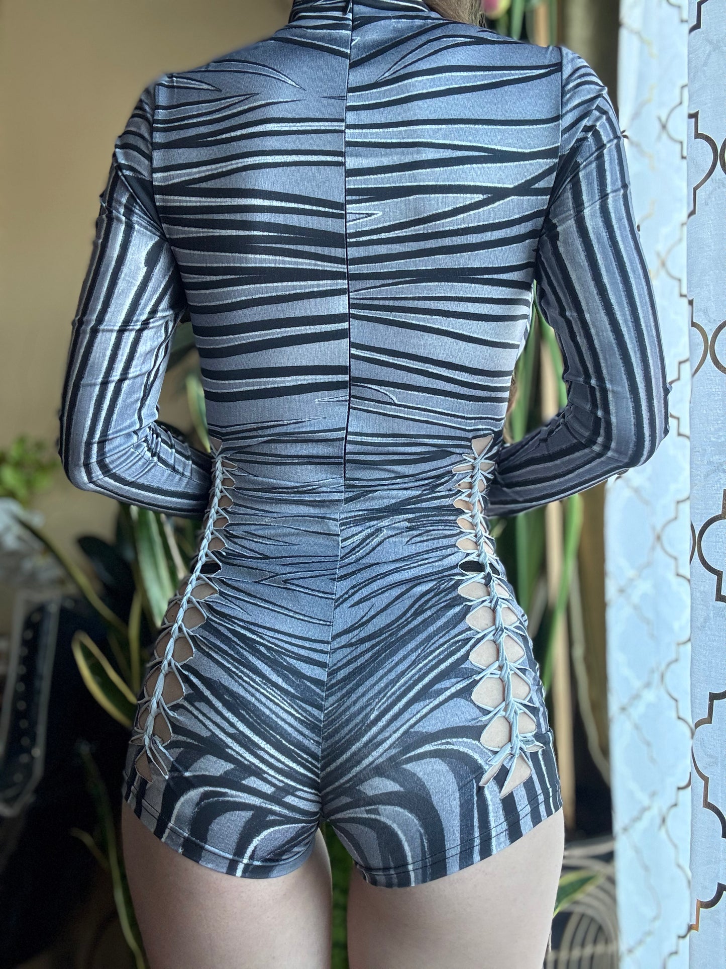 MONOCHROME ZEBRA MOCK NECK LONG SLEEVE BRAIDED ROMPER
